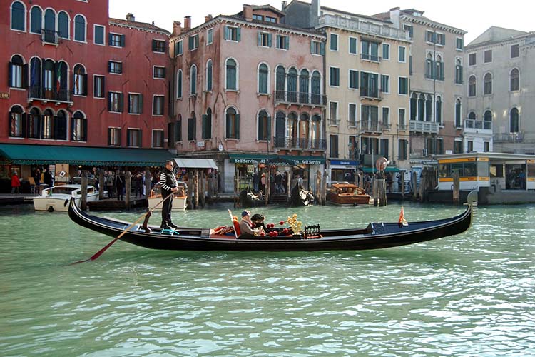 Take the gondola for a romantic sunset experience during your weekend getaway for a couple in Venice (photo provided by italyvisa.ae 